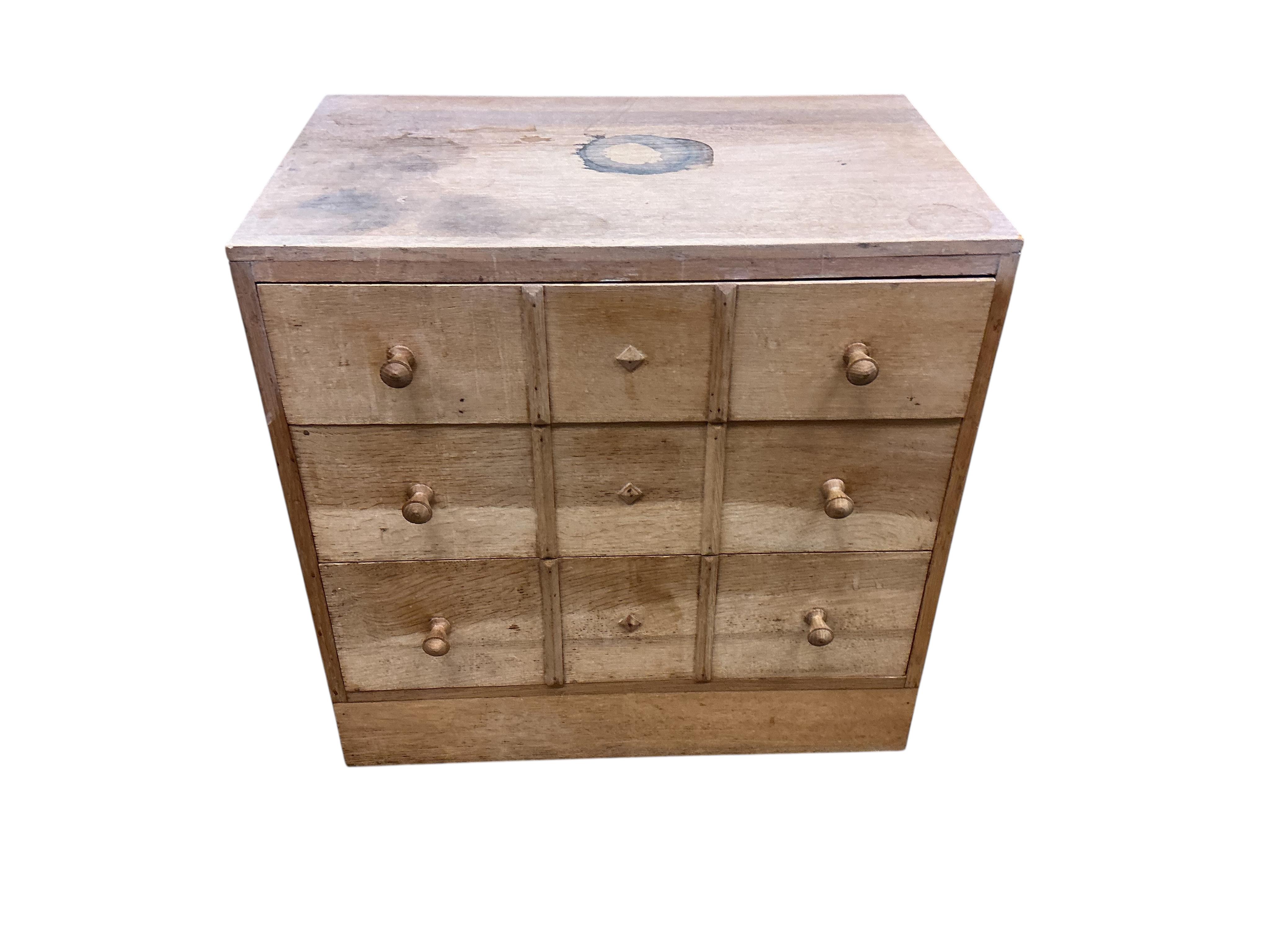 A pair of small limed oak three drawer chests in the manner of Heals, width 68cm, depth 43cm, height 68cm